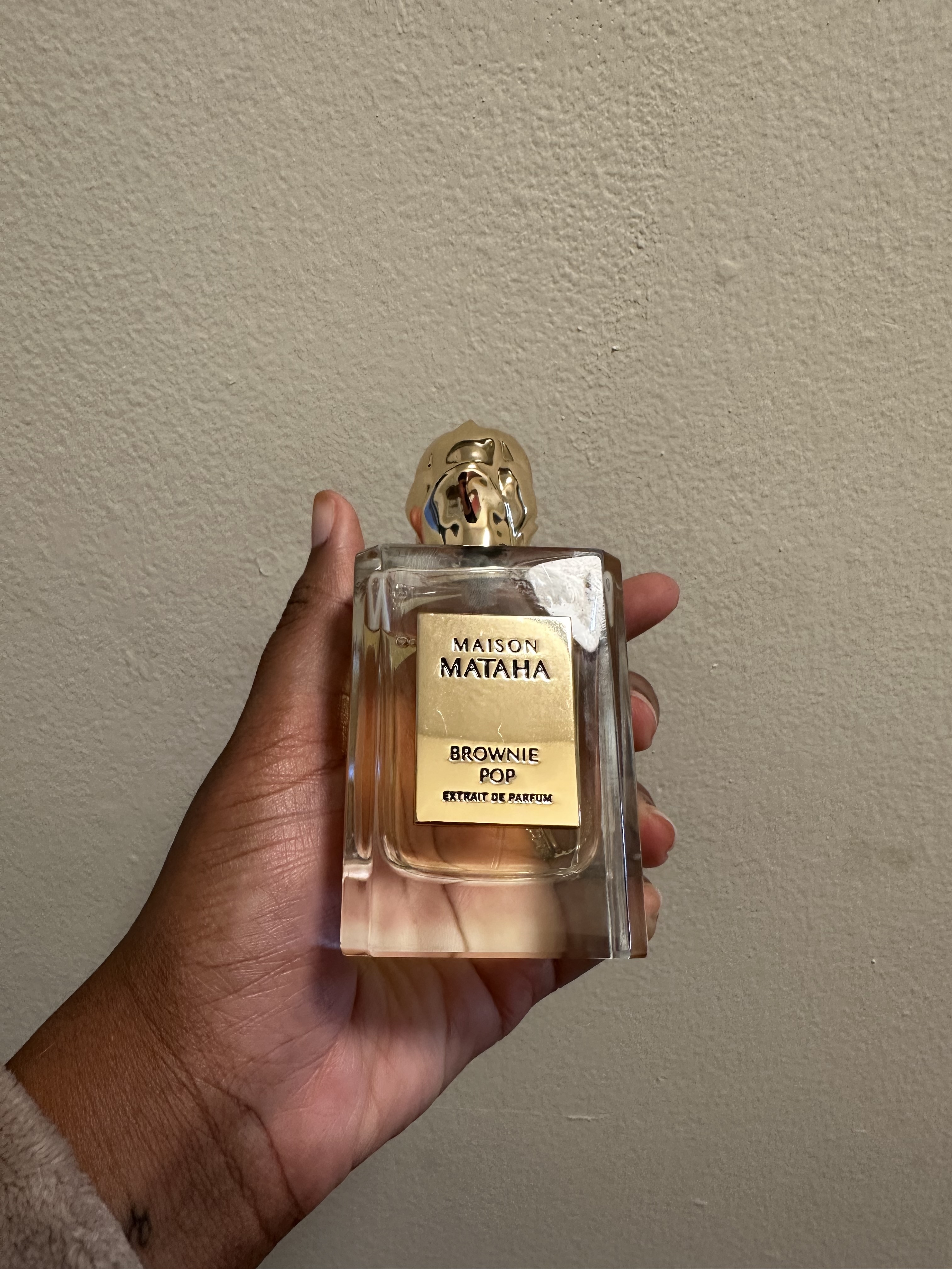 Ariel Baker testing Maison Mataha Brownie Pop perfume.