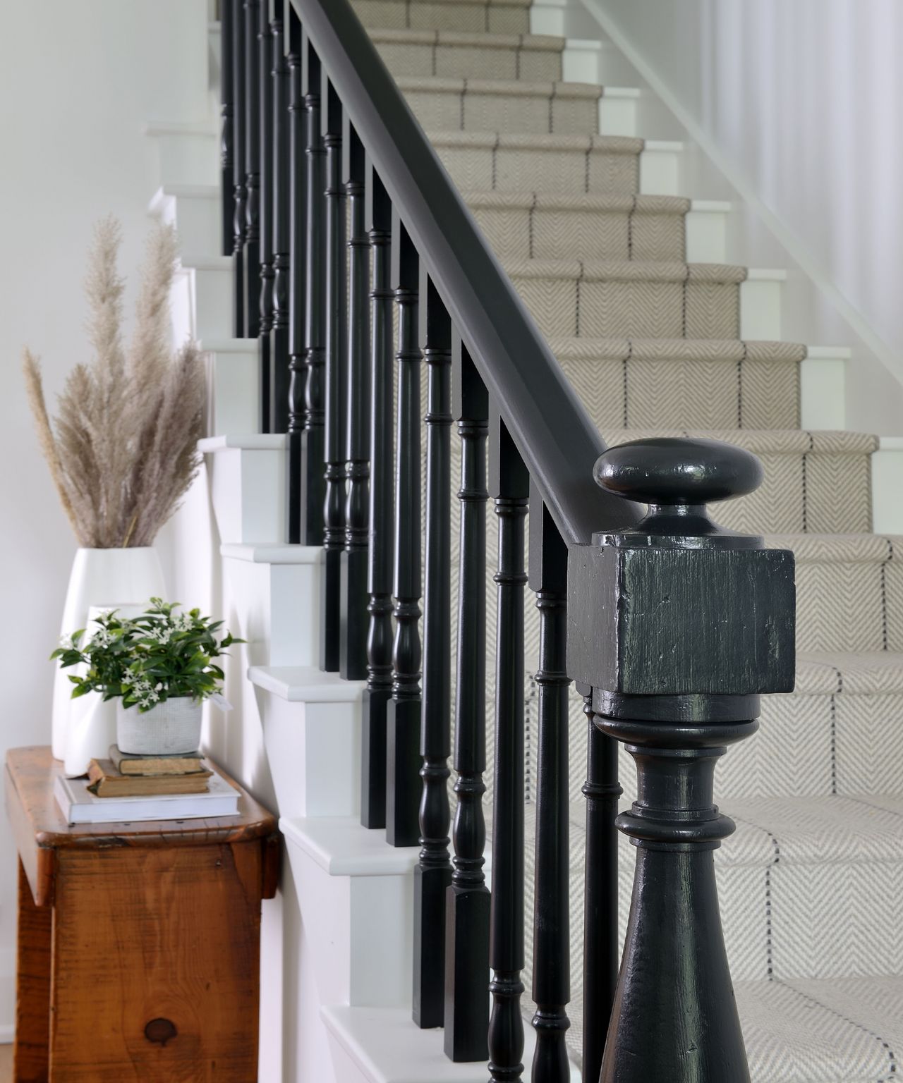 White staircase with black painted banister