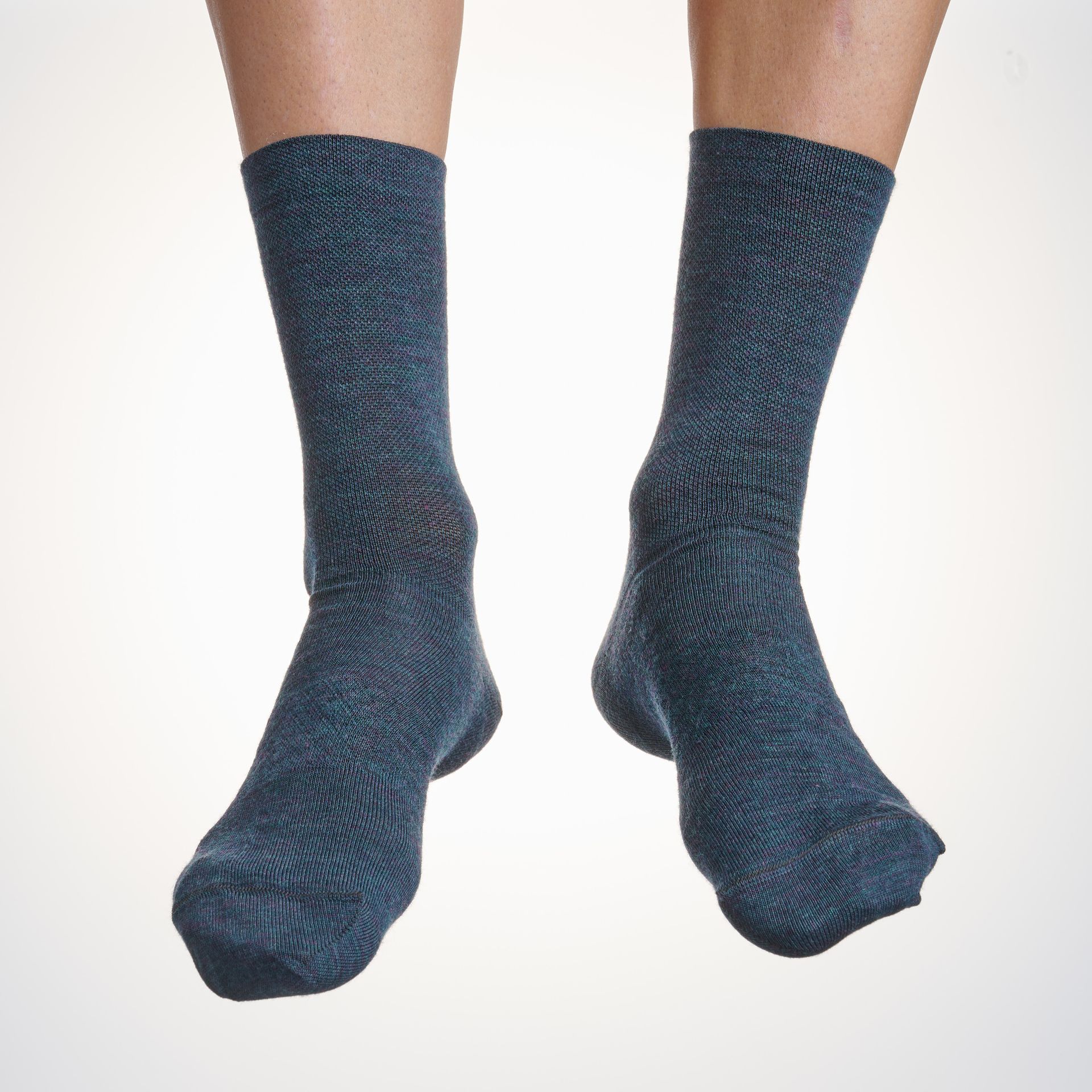 Male cyclist wearing the Velocio Signature Wool cycling socks