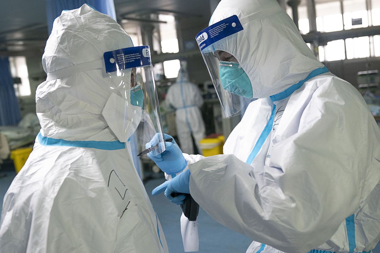 Chinese doctors wear protective gear while treating Wuhan coronavirus patients.