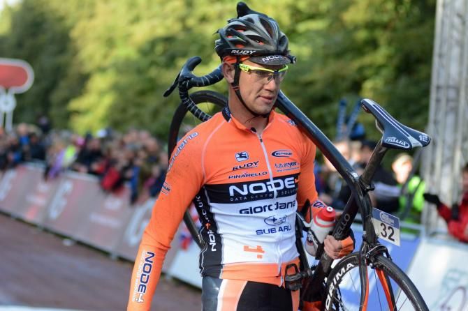 Roman van Uden crosses the line on foot after crashing