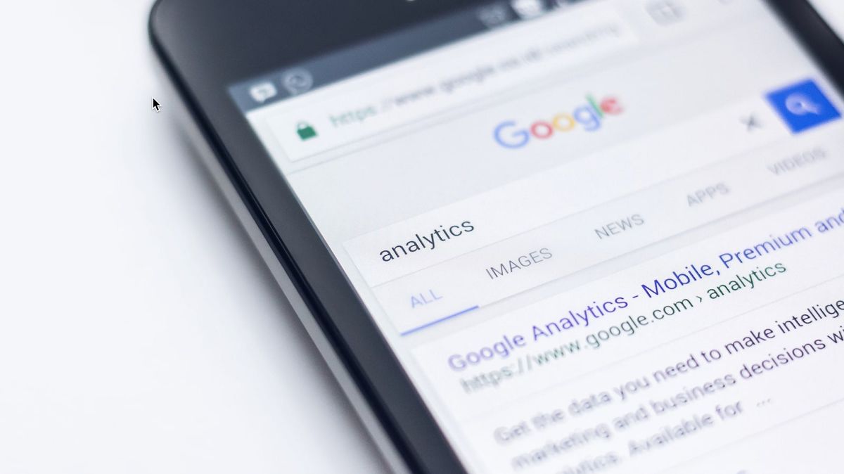 Google&#039;s search page results for analytics displayed on an iphone