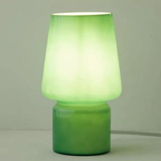 little glasss lamp in green with a warm glow