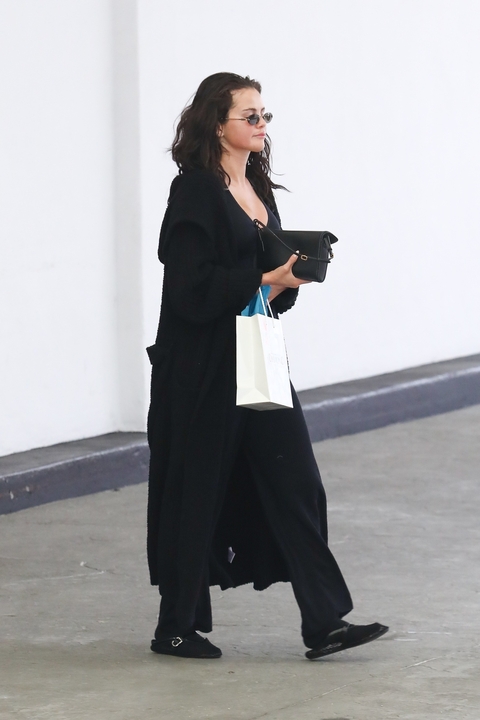 Selena Gomez wore the mesh ballet flats trend in a backless loafer form