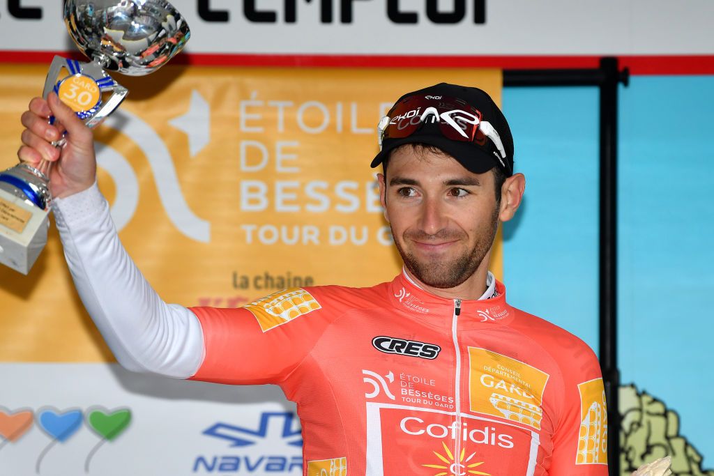 ALES FRANCE FEBRUARY 06 Benjamin Thomas of France and Team Cofidis celebrates winning the orange leader jersey on the podium ceremony after the 52nd toile De Bessges Tour Du Gard 2022 Stage 5 a 11km individual time trial from Als to Als lErmitage ITT EDB2022 on February 06 2022 in Als France Photo by Luc ClaessenGetty Images