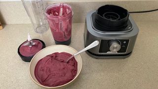 Ninja Foodi Power Blender & Processor System with berry and yoghurt ingredients inside blended into a smoothie