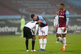 Fulham's Ademola Lookman is consoled by West Ham pair Fabian Balbuena and Sebastian Haller after a missed penalty at the London Stadium in November 2020.