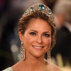 Princess Madeleine of Sweden wearing a tiara featuring emeralds