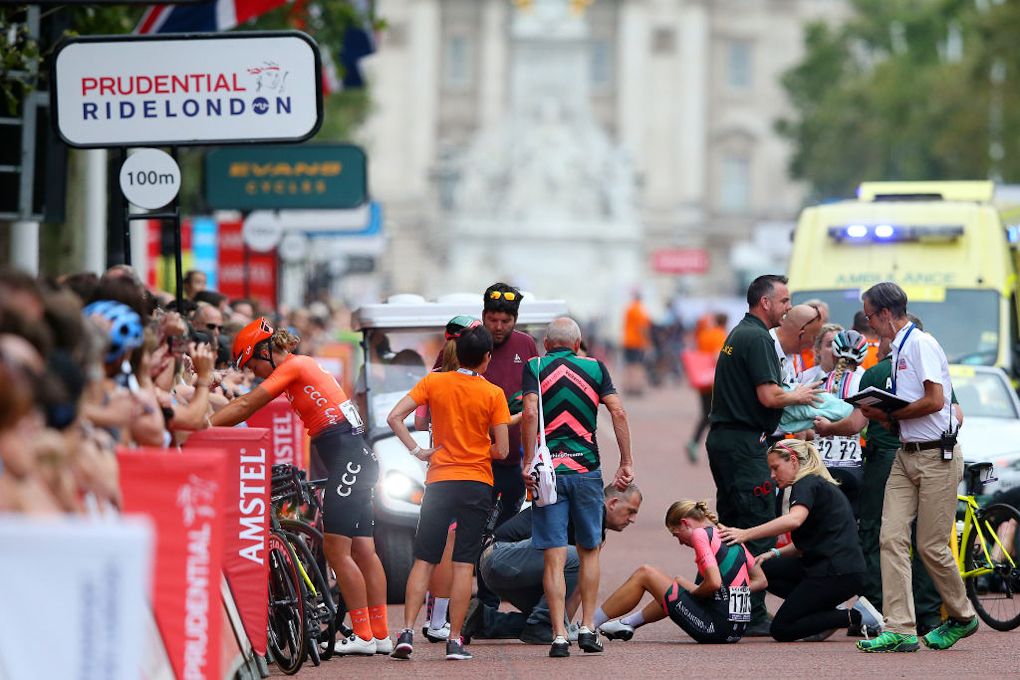 Medical personnel and team staff tend to riders at RideLondon Classique