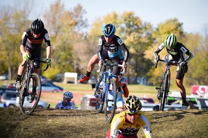Orton, Mani, and Antonneau remounting their bikes on lap two