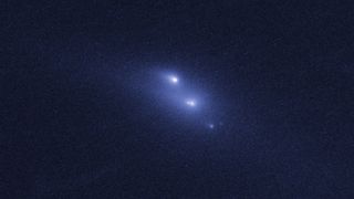 This photo from the Hubble Space Telescope shows the rare sight of the asteroid P/2013 R3 breaking apart. This image, the first in a series, was taken on Oct. 29, 2013.