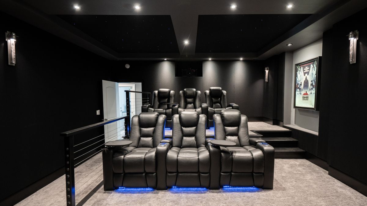 Basement Buildout Magic home theater showing seats, lighting and screen