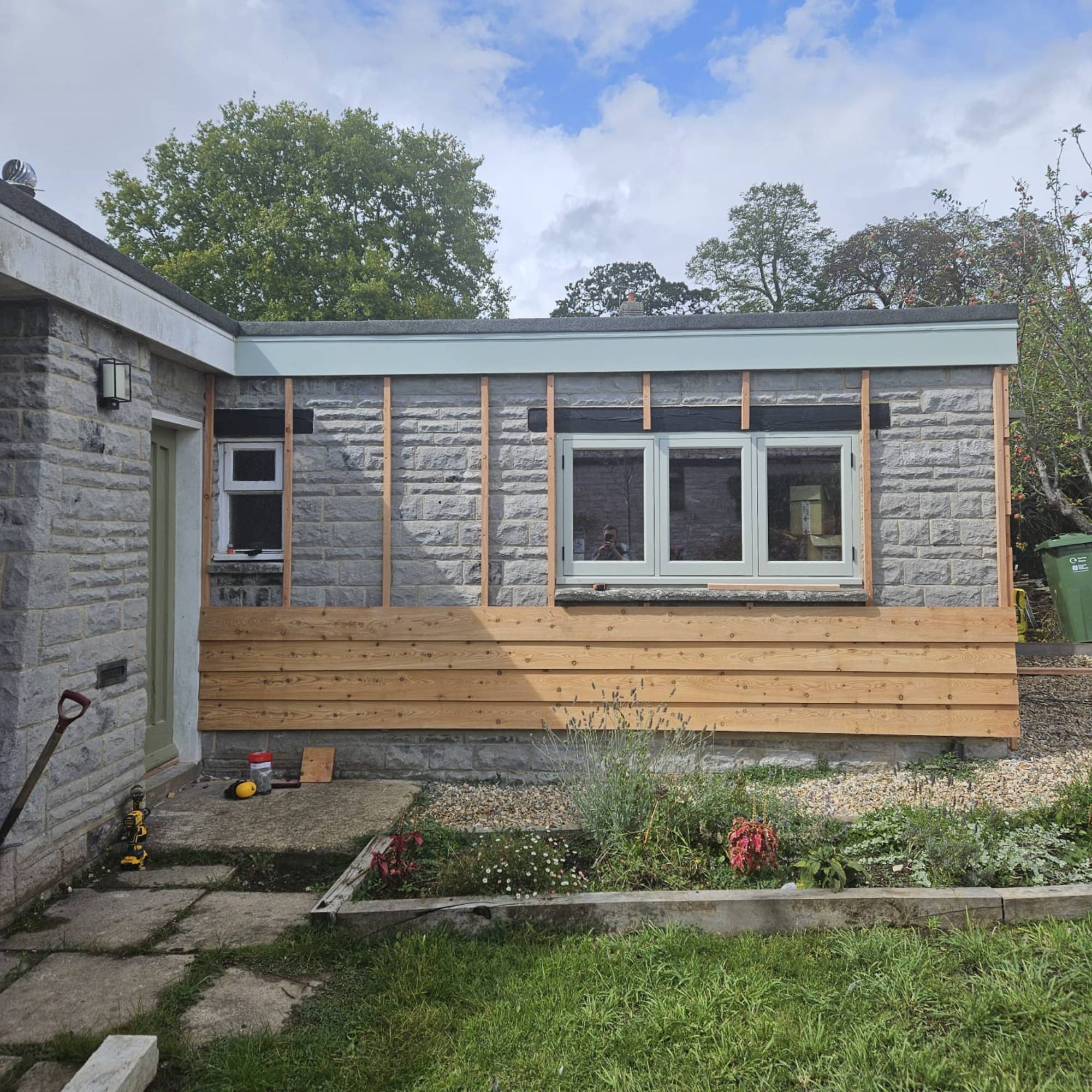 timber cladding being installed on garage