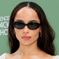 Zoe kravitz wears black sunglasses.