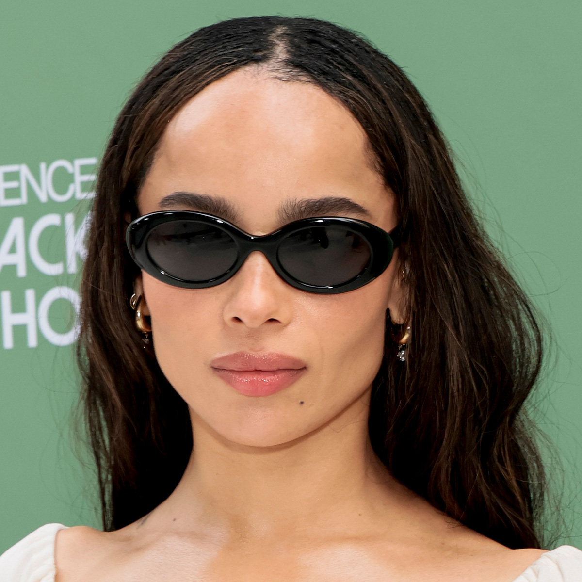 Zoe kravitz wears black sunglasses.