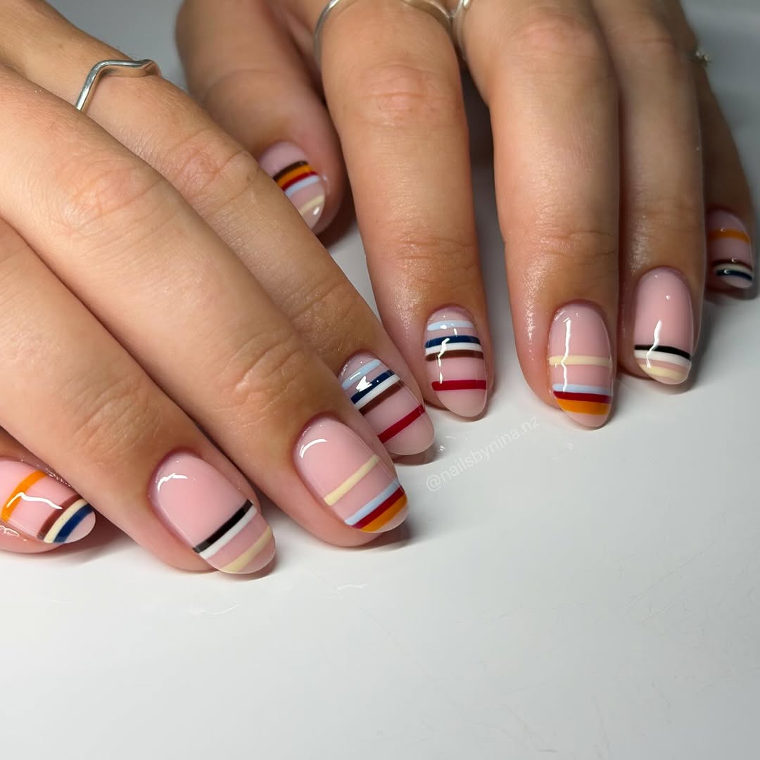 varying horizontal stripes on a nude nail base
