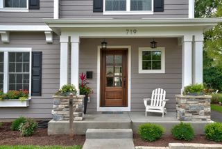 exterior of house painted gray with white accents