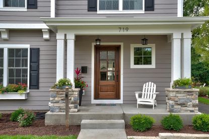 exterior of house painted gray with white accents