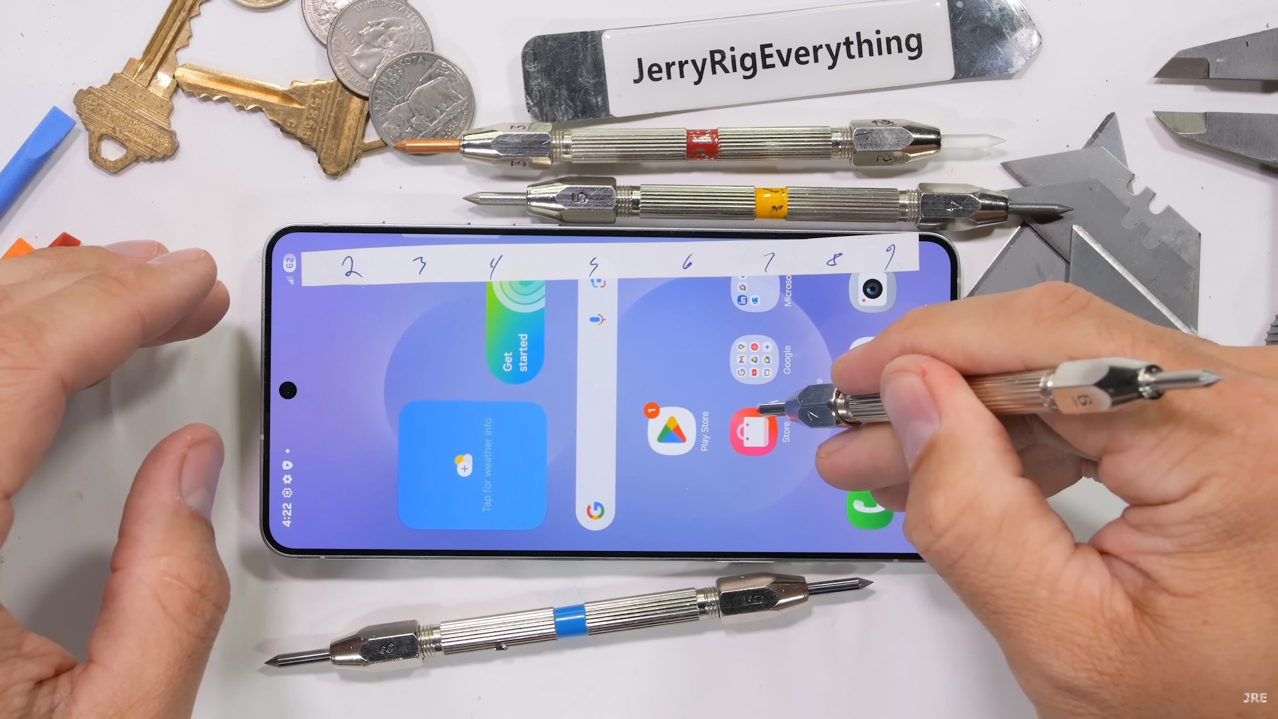 Galaxy S25 Edge durability test by JerryRigEverything, showing the display being scratched by a mineral pick