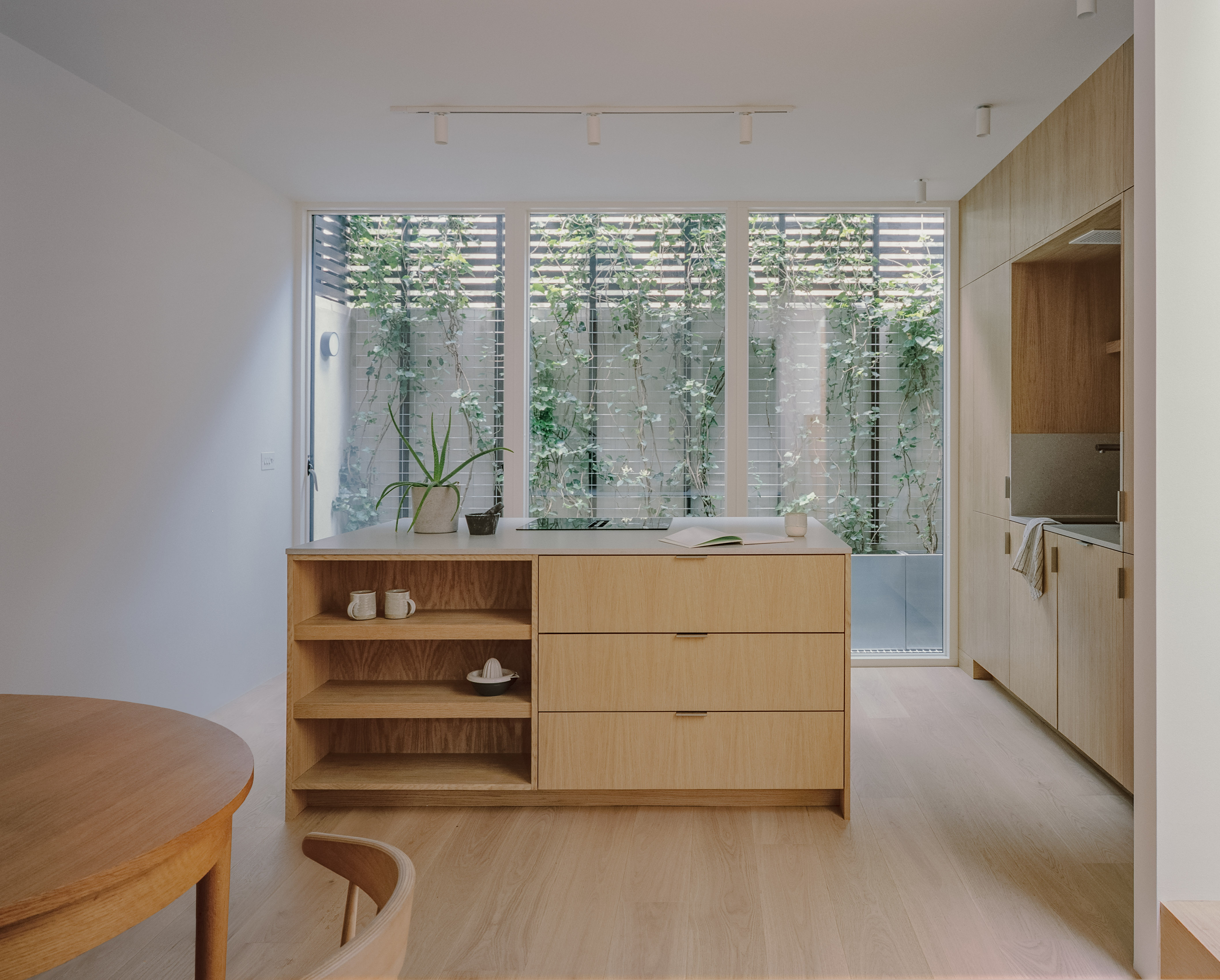 The ground floor kitchen overlooks a green living wall