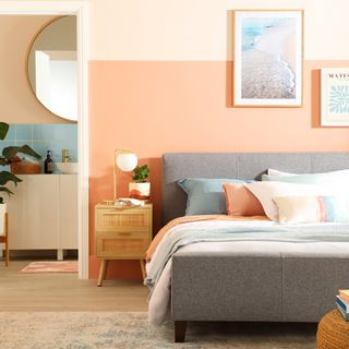 coral and grey bedroom with ensuite, artwork, metallic accessories