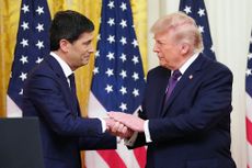 Kevin Warsh and Donald Trump shaking hands