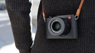 The Leica Q2 hanging around a photographer's neck