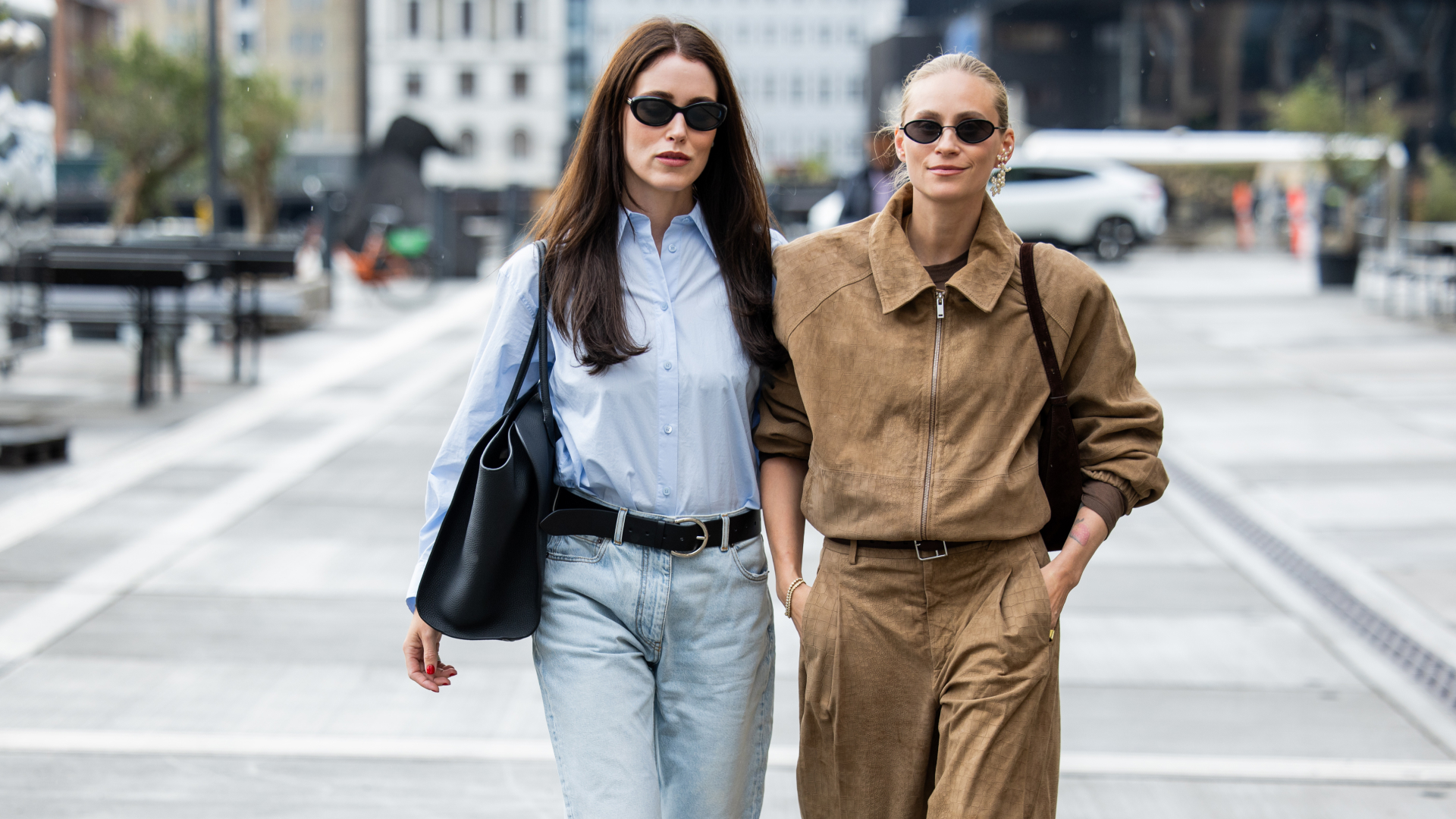 nnabel Rosendahl wears blue blouse, ripped denim jeans, black bag & Tine Andrea wears light brown zipper jacket, pants outside Gestuz during Copenhagen Fashion Week day three on August 06, 2025 in Copenhagen, Denmark. (Photo by Christian Vierig/Getty Images)