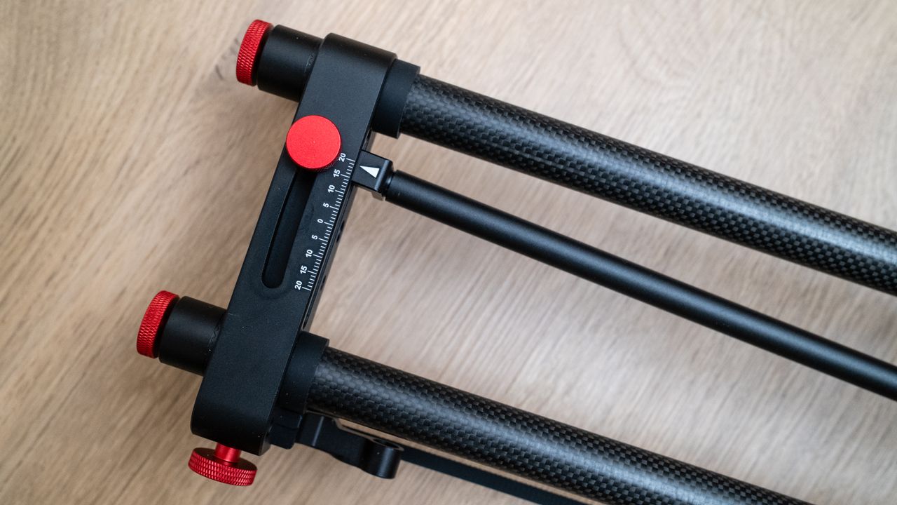 Close-up of the movement scale on a Neewer ER1 Motorized Carbon Fiber Camera Slider on a wooden surface