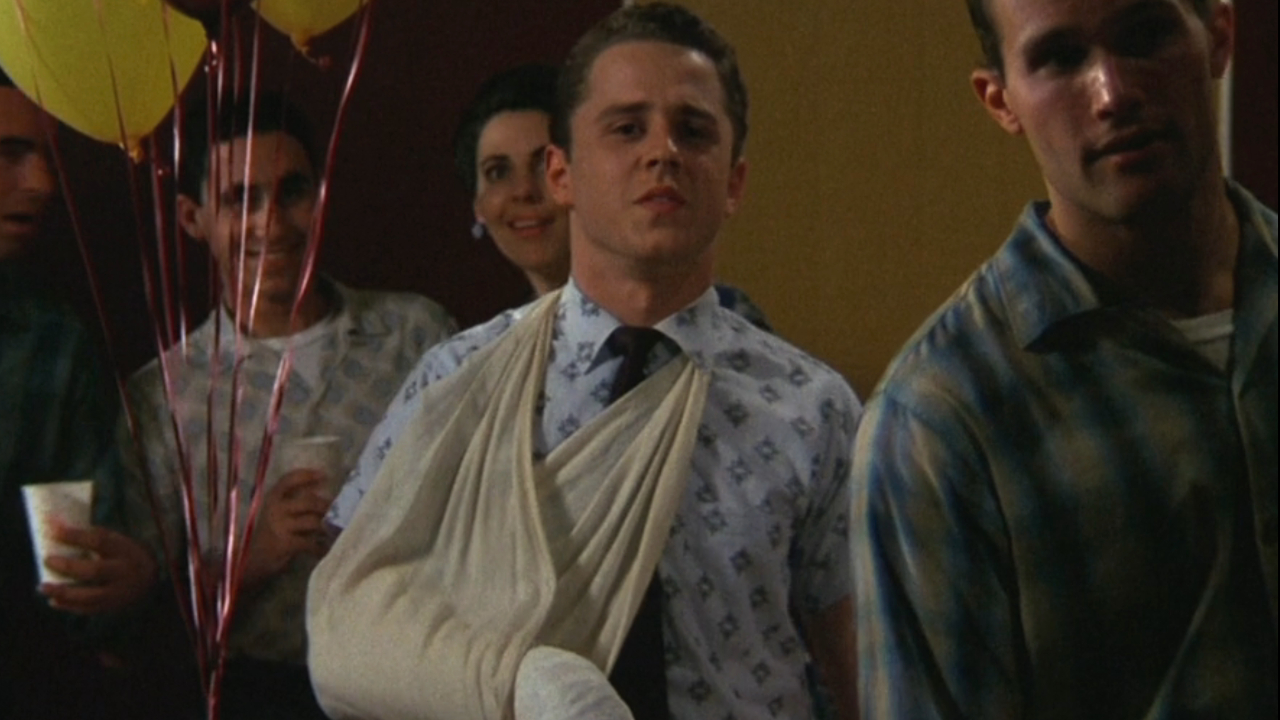 Giovanni Ribisi looking upset in the middle of the talent show crowd in That Thing You Do!