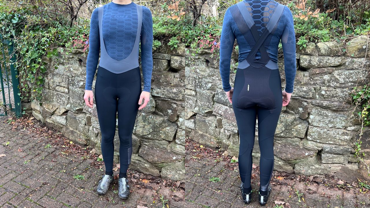 Q36.5 Gregarius Hybrid Light bib tights shown front and back against a stone wall