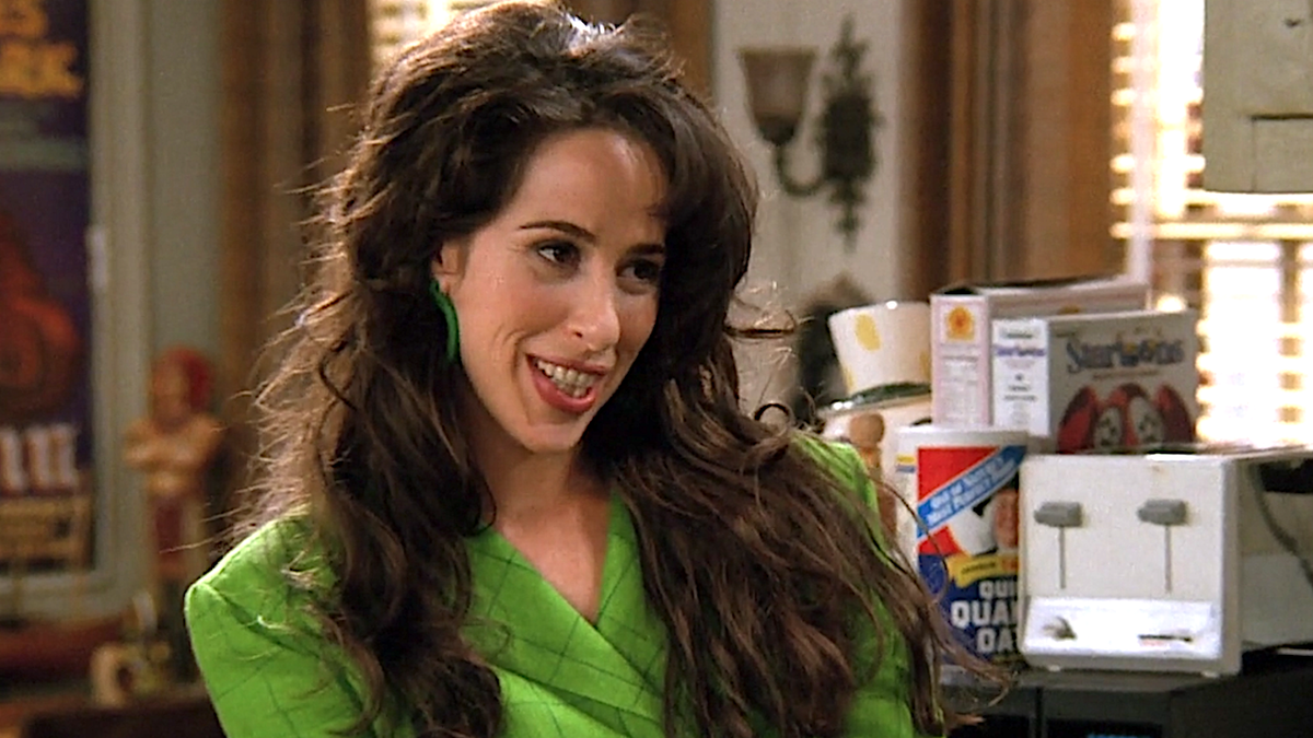 Janice stands in Chandler and Joey&#039;s apartment on Friends.