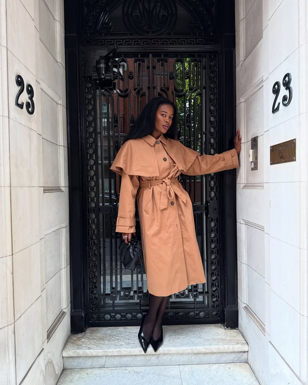 Marilyn NK wearing the cape Nobody's Child trench coat