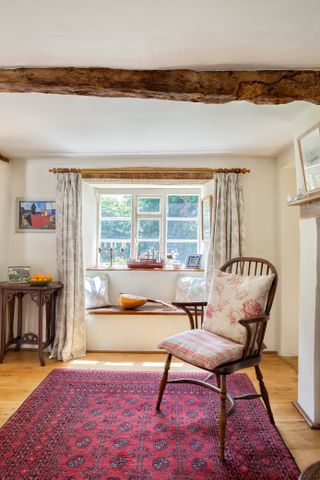 windsor chair and beams in 17th century thatched cottage