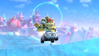 Bowser leaping in the air driving the Baby Blooper kart in Mario Kart World