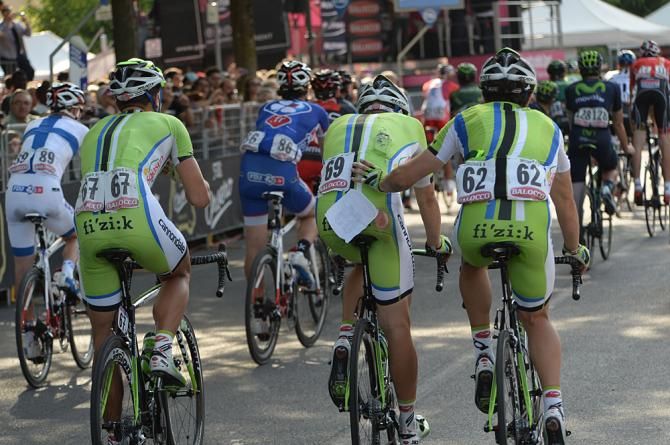 Cannondale riders help each other get to the finish line following a crash in the last kilometer of Stage 10