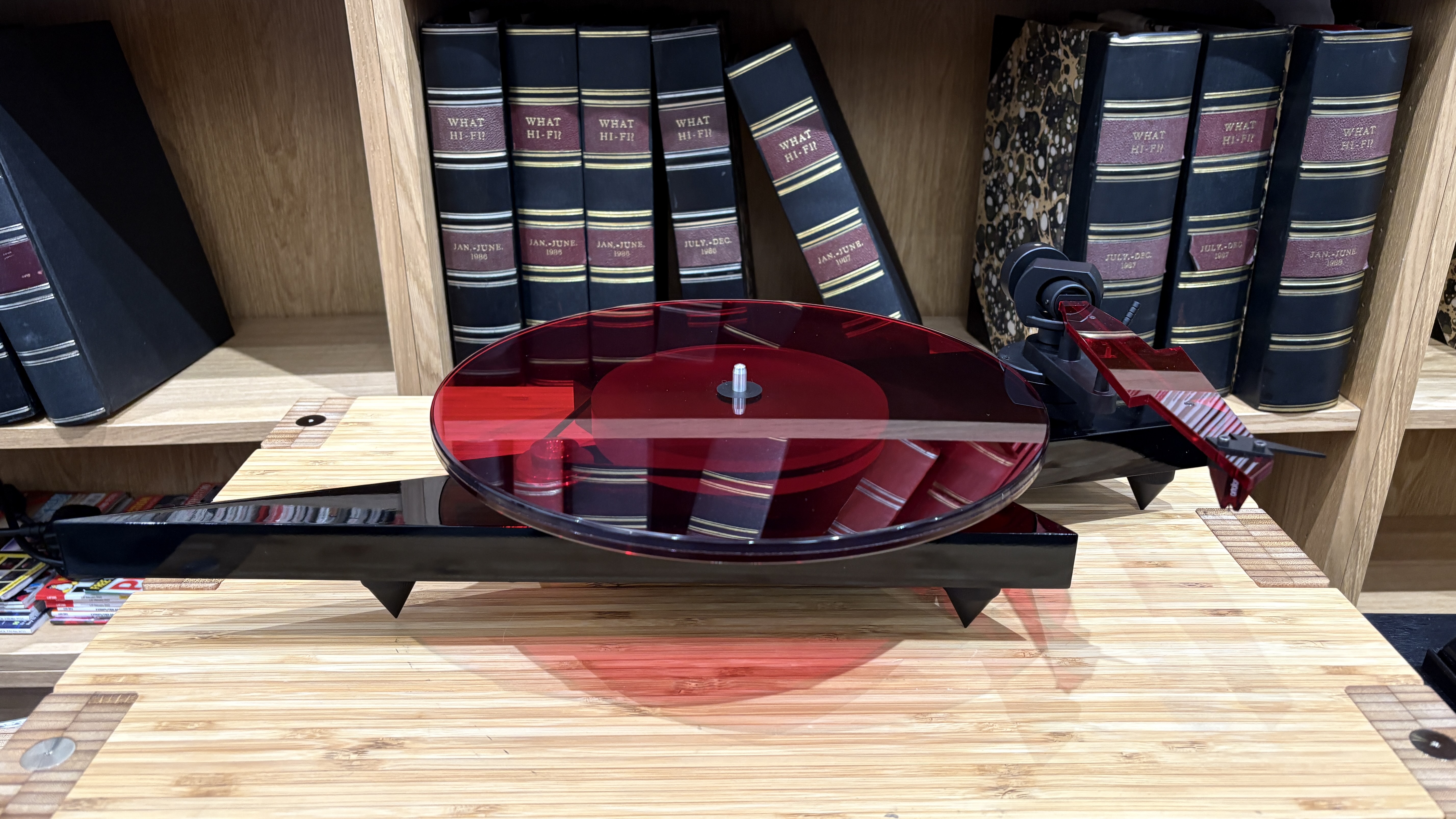 Pro-Ject AC/DC Turntable on wooden hi-fi rack