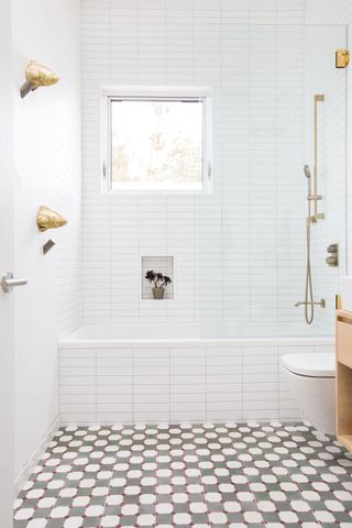 White bathroom with patterned floor tiles