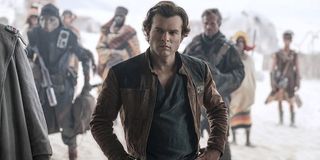 Solo: A Star Wars Story Alden Ehrenreich Han Solo arms akimbo in the desert