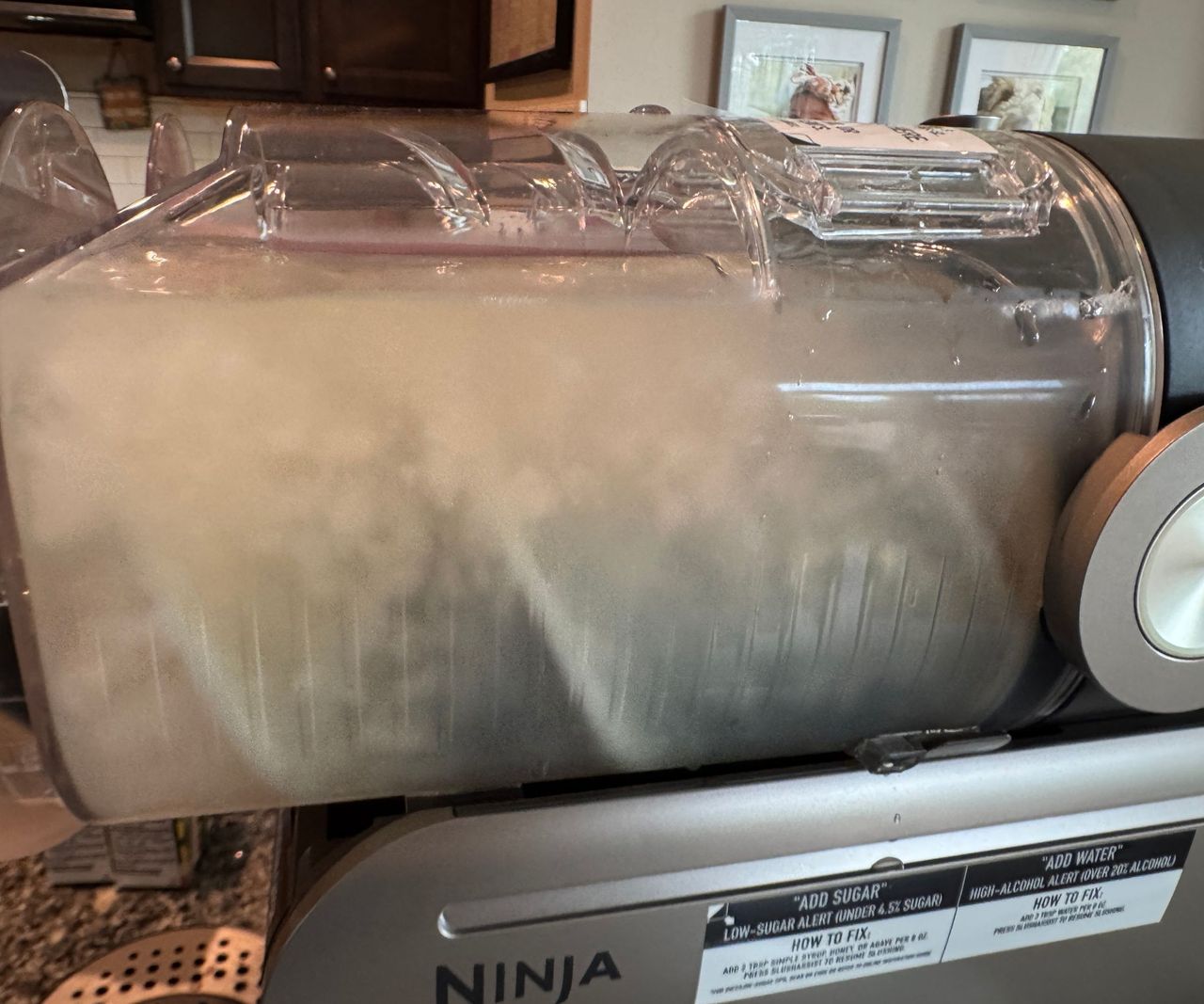 A close up view of white slush being chilled in the ninja slushi twist