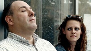 James Gandolfini and Kristin Stewart sitting in front of a scratched up window in Welcome to the Rileys.