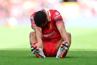 Trent Alexander-Arnold of Liverpool looks dejected following the team's defeat during the Premier League match between Liverpool FC and Nottingham Forest FC at Anfield on September 14, 2024 in Liverpool, England.