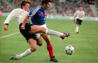 France's Bixente Lizarazu holds off England's Darren Anderton in a friendly in 2000.