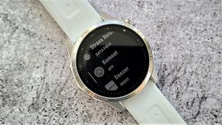 Garmin Fenix 7 watch with Komoot app selected on screen