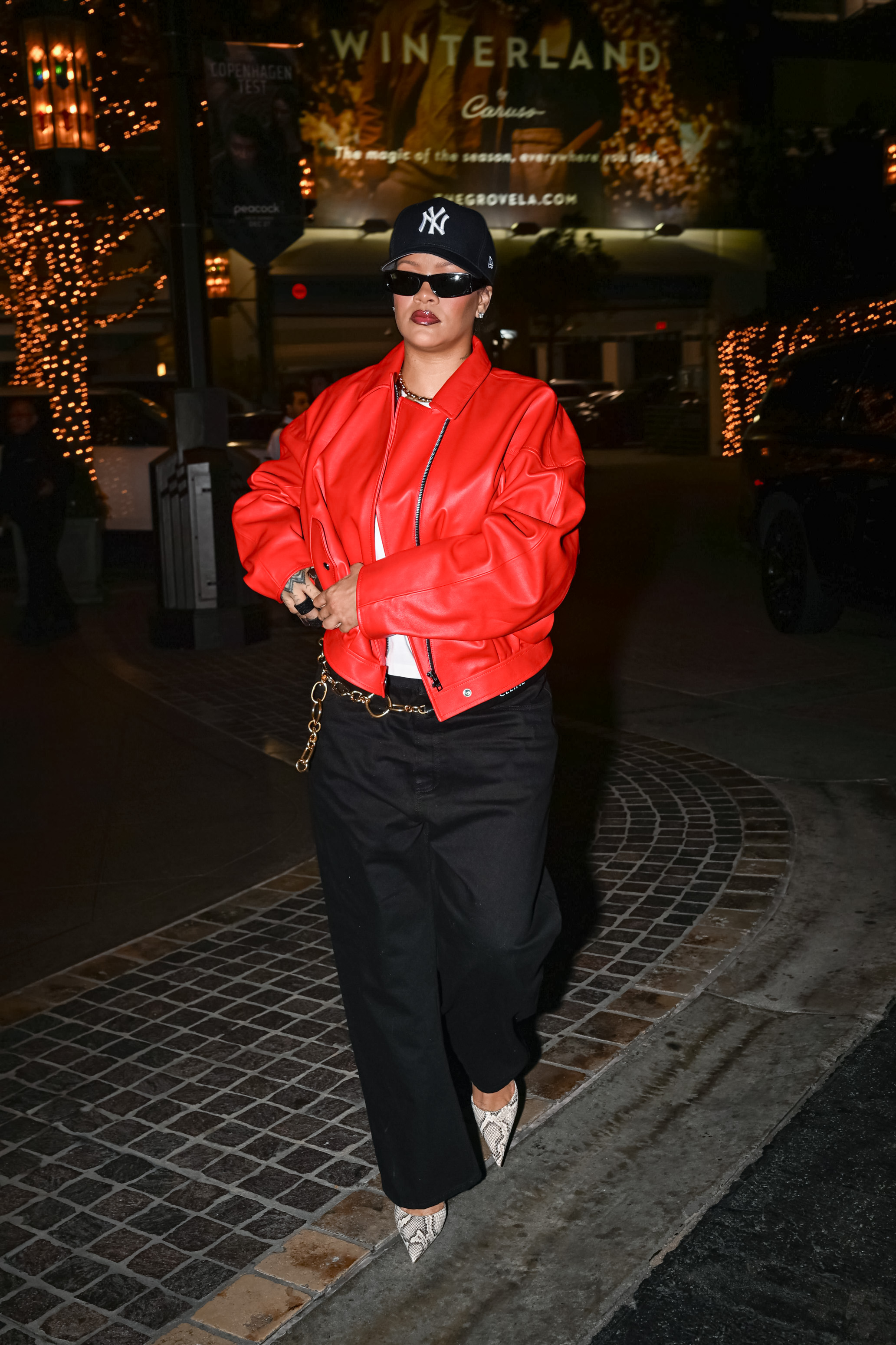 Rihanna ran errands in L.A. while wearing a red leather bomber jacket and python pumps