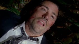 Matthew Fox looking up, wearing a suit and tie in the opening moments of Lost