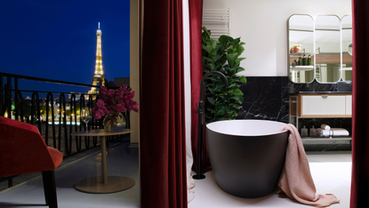 Photo shows a view of the Eiffel Tower from a bathroom in Hotel Villa Marquis