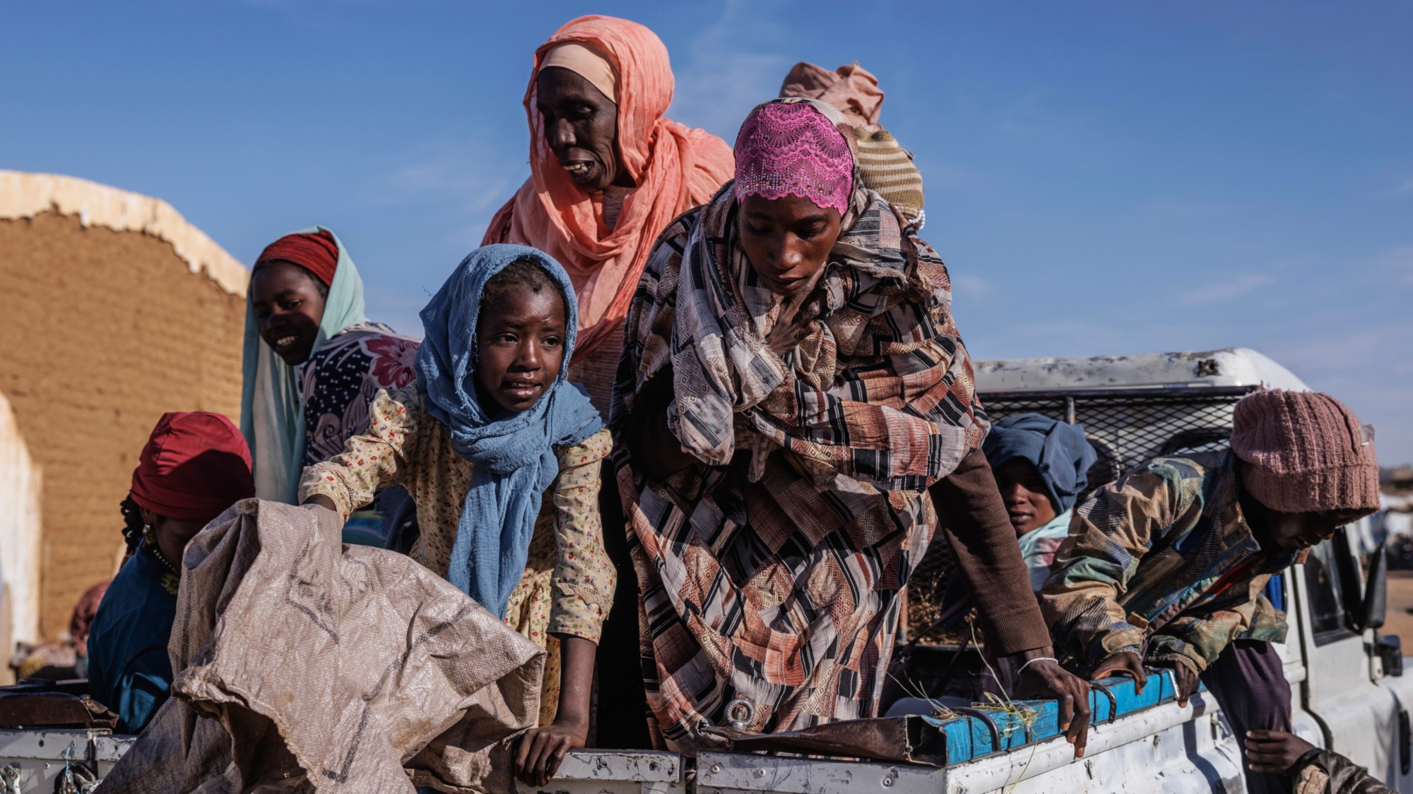 Recently arrived Sudanese refugees arrive at a food distribution centre at the Oure Cassoni refugee camp on February 24, 2026 in Oure Cassoni, Chad