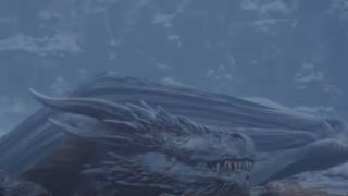 Viserion sinking into a lake in Game of Thrones.
