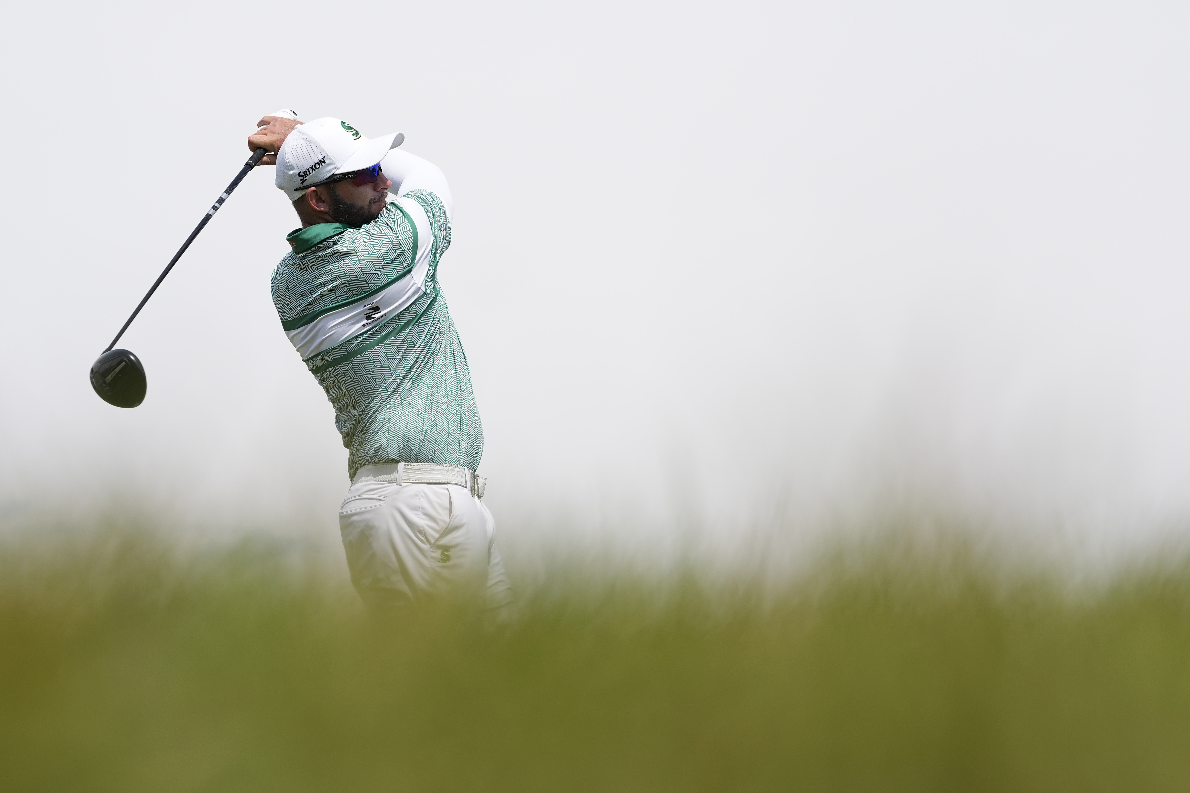 Dean Burmester hits a driver off the tee